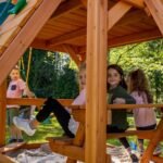 Gorilla Playsets Empire Extreme Wooden Swing Set with Monkey Bars, Clatter Bridge, Tower, and 3 Slides - Image 6