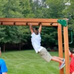 Gorilla Playsets Empire Extreme Wooden Swing Set with Monkey Bars, Clatter Bridge, Tower, and 3 Slides - Image 7